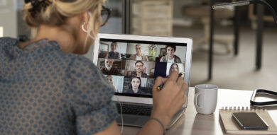 white woman looks at her zoom colleagues