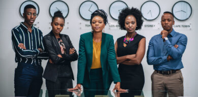 african business people standing in front of clocks- design for localization webinar