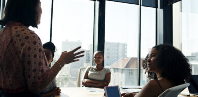 diverse group of UX stakeholders discuss product strategy