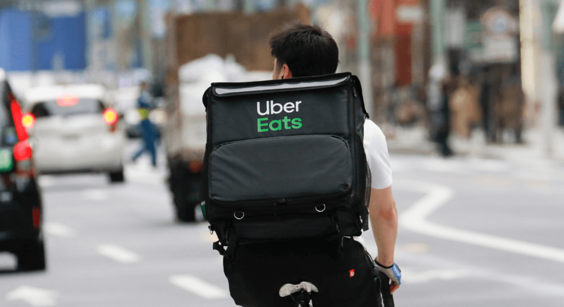 uber eats delivery guy on a bike